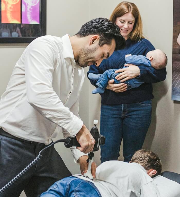 Stonebridge chiropractor Dr Logan adjusting kid patients back