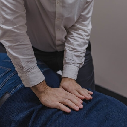 Dr Andy adjusting patients back