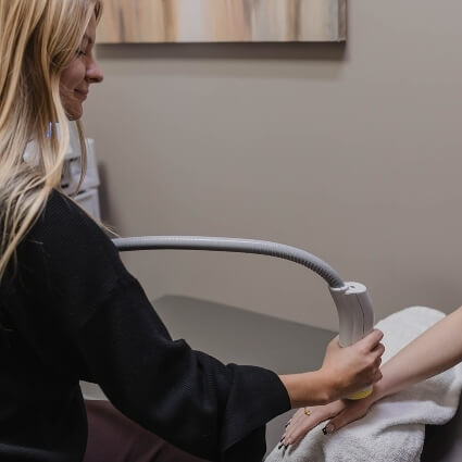 softwave treatment on persons wrist