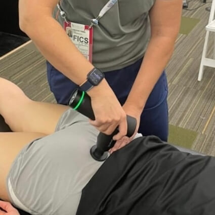 patient having back adjusted with tool