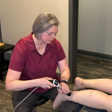 shockwave therapy on persons foot