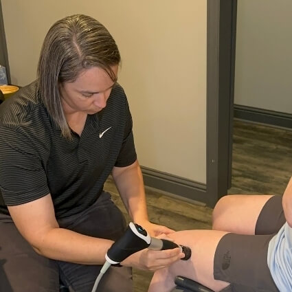 shockwave therapy on persons knee