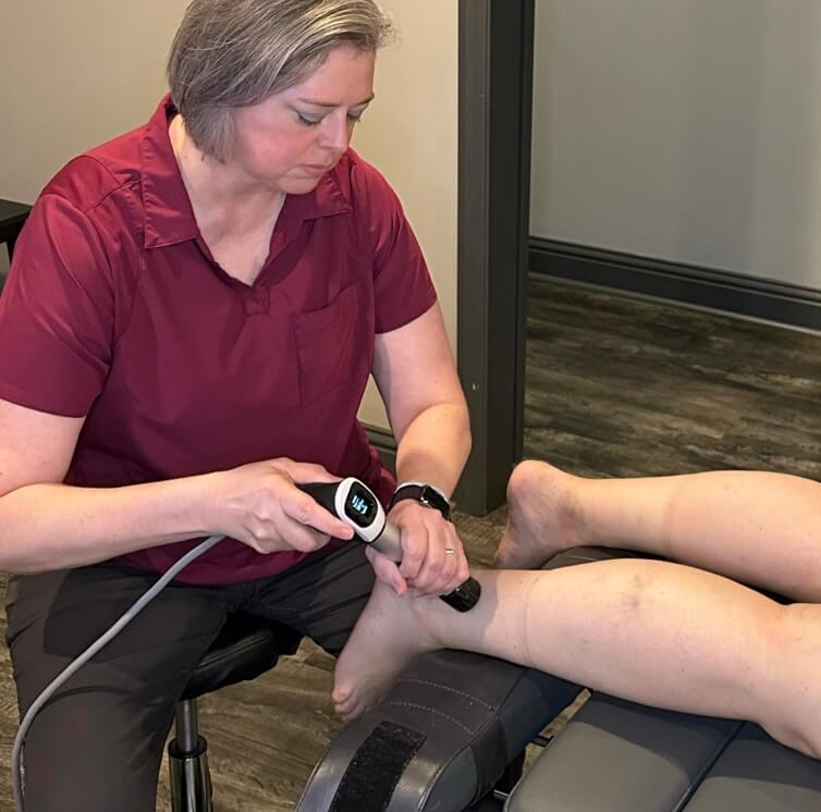 shockwave therapy on persons leg