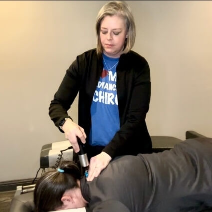 patient having neck adjusted with tool