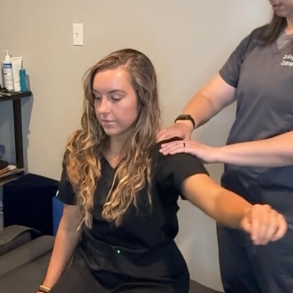 Dr Maggie adjusting patients arm