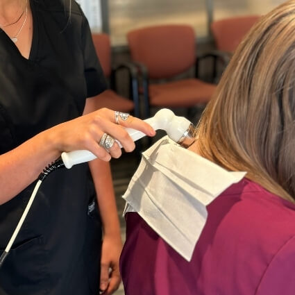 shockwave therapy on persons neck