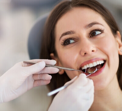 Young female smiling during dental checkup