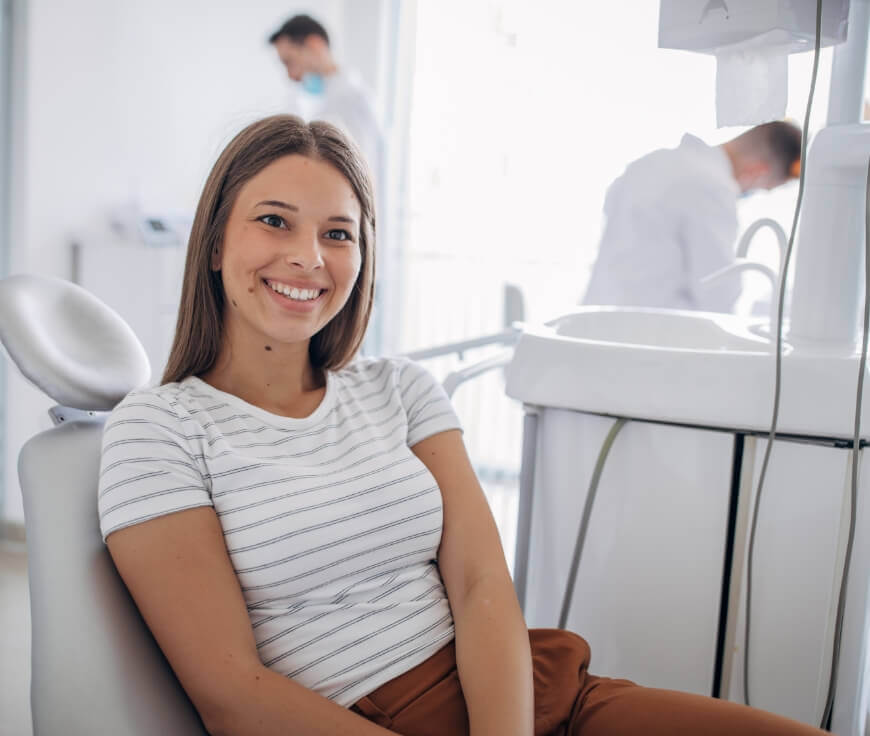 Female patient in dental office smiling