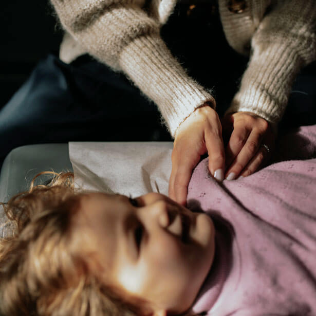 Chiropractor with a baby