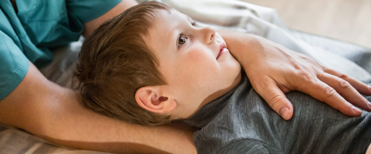 chiropractor adjusting child