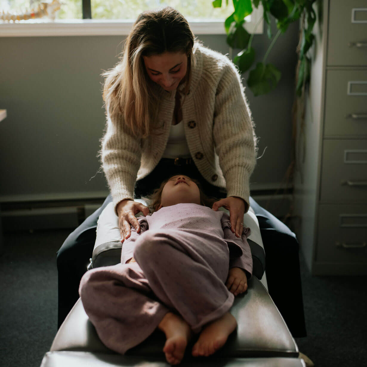 Chiropractor adjusting patient