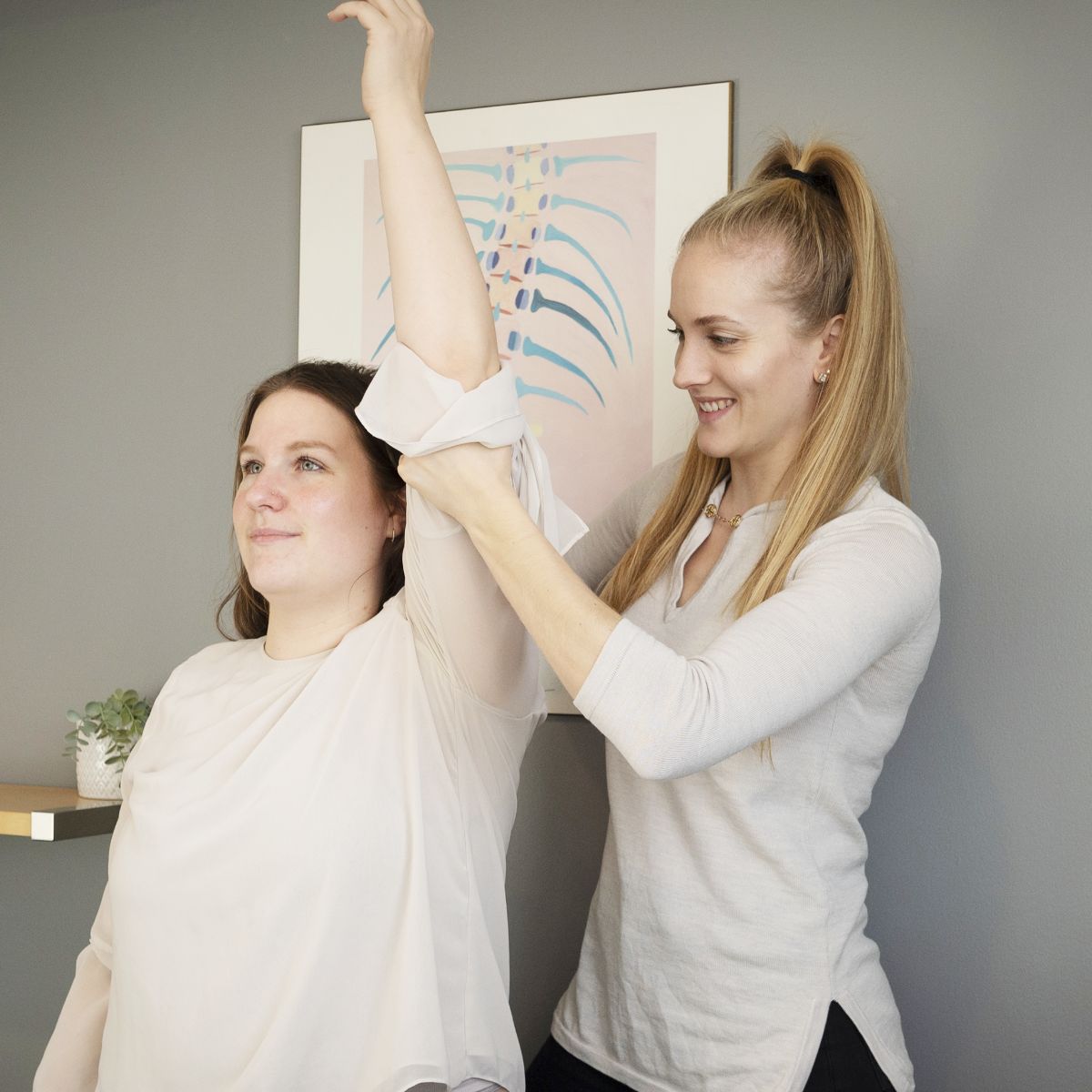 Chiropractor helping patient stretch