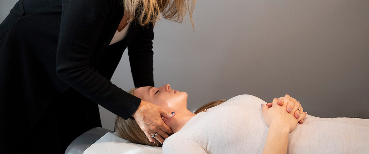 adjusting patients neck