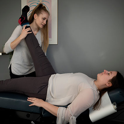 stretching a patient's leg