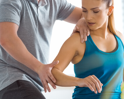 Chiropractor adjusting female patient