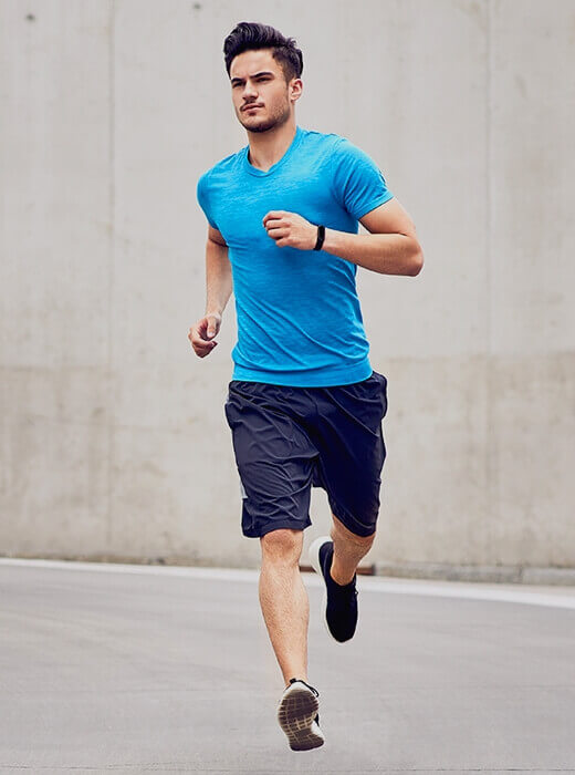 Man wearing blue shirt running