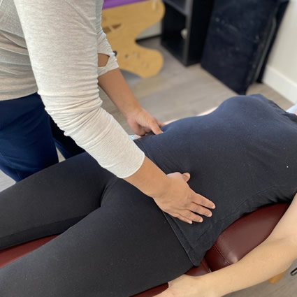 pregnant person being adjusted