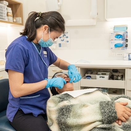 Maddington dentist Dr Jamie working on patient during dental checkup