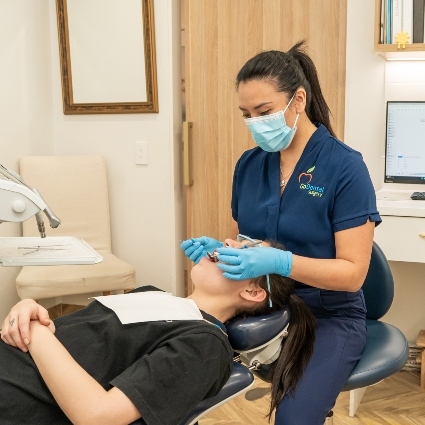 Dr Tiffany working on a dental patient