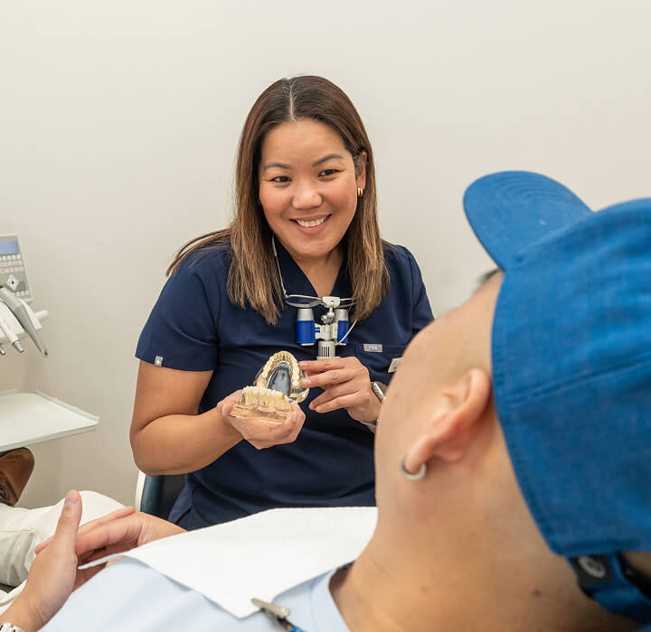 Dentist talking to patient