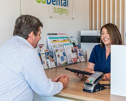 Man paying at reception