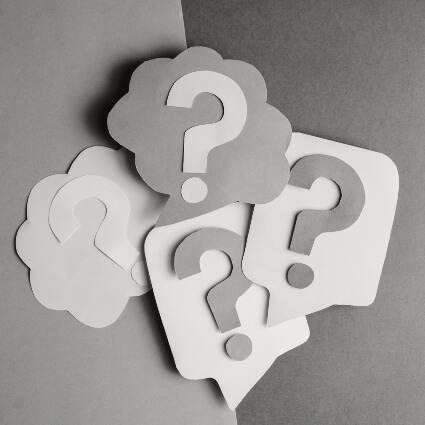 question marks on a notebook