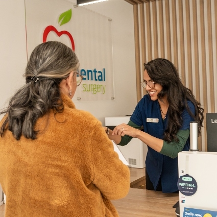 front office staff welcoming patient