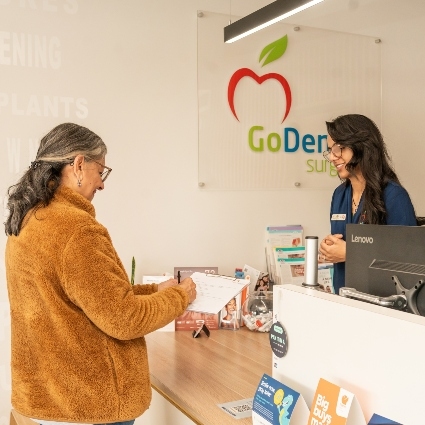 patient at the Go Dental Surgery front desk