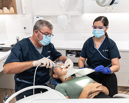 Dentist treating teeth