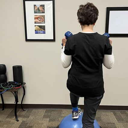 A woman performing rehab exercise.