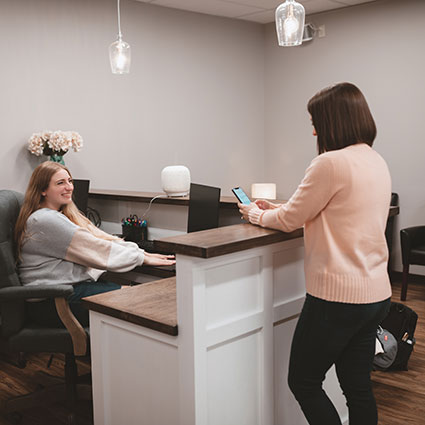 Woman at reception desk