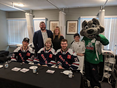 Doc with the Wolf Pack players