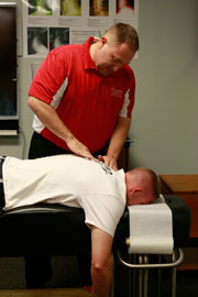 Lincoln Chiropractor Dr. Sjohn Watson adjusting a patient