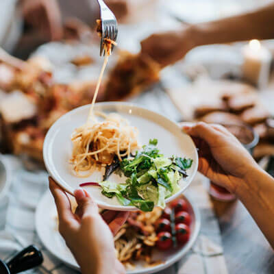 pasta being served on a plate