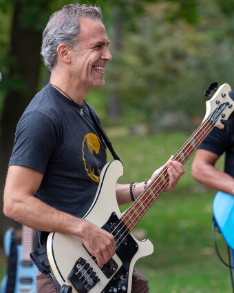 Dr. Robert Shire playing guitar