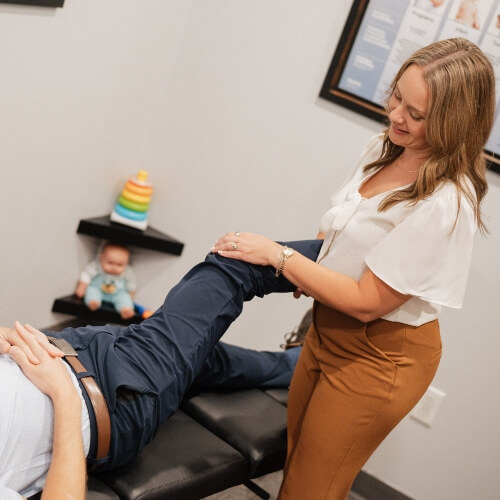 Chiropractor adjusting a patient