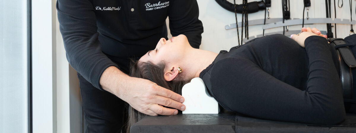 Barrhaven chiropractor adjusting a patient's neck