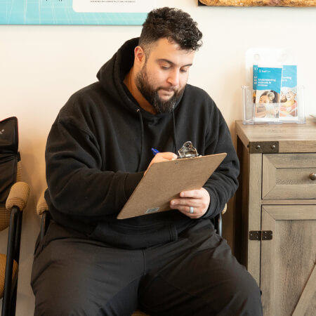 person filling out paperwork