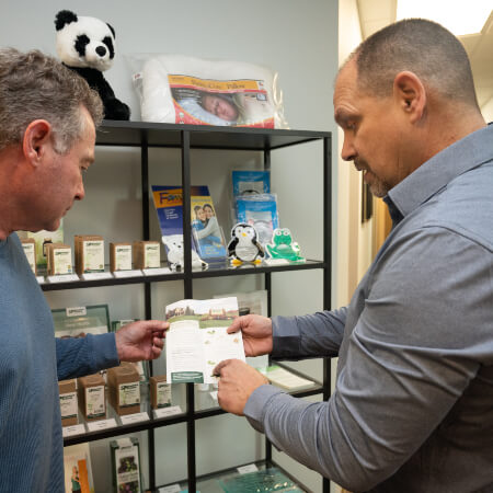 Chiropractor discussing nutritional supplements with patient