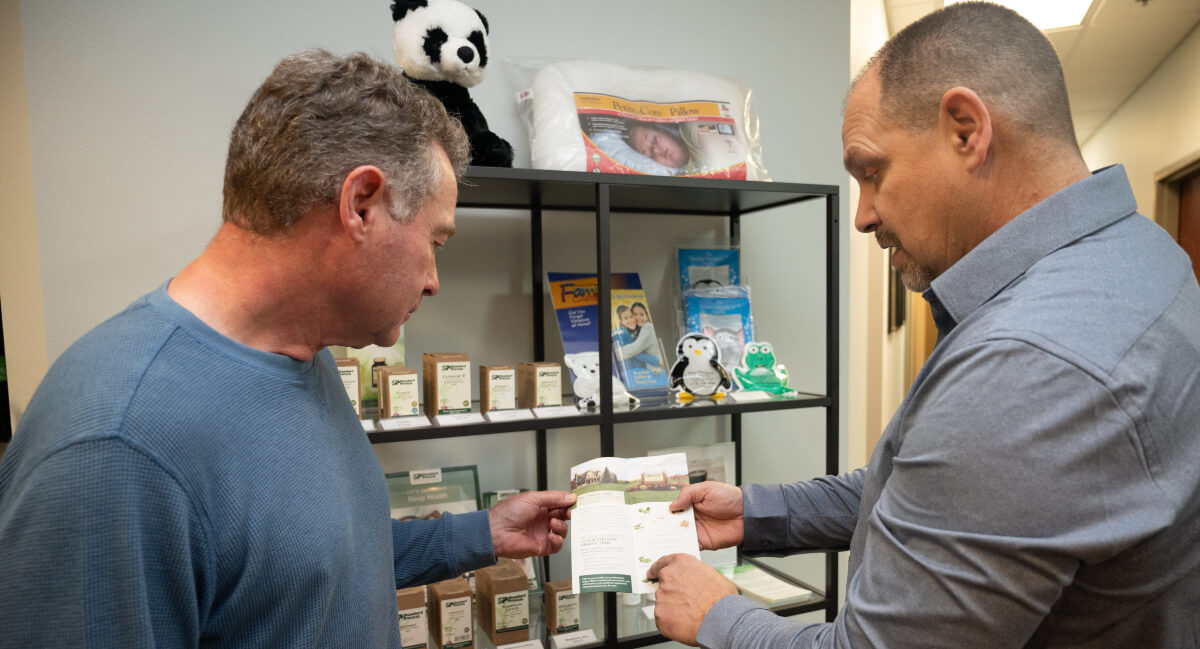 Chiropractor in discussion with a patient