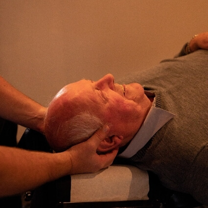 person having their neck adjusted at Chiropractic Edge