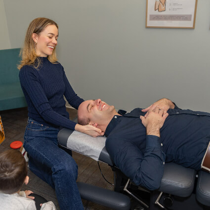 Dr. Mackenzie adjusting man's neck