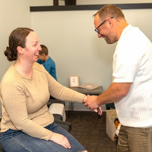 Chiropractor treating patient's wrist