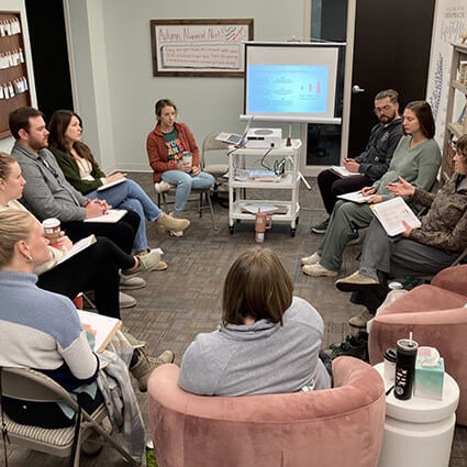 Close up of hands forming a heart on pregnant belly
