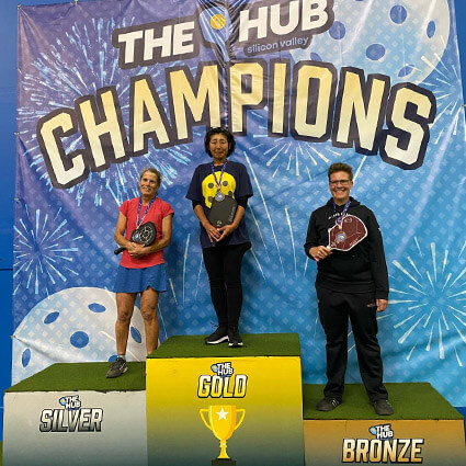 Dr. Paige winning bronze in pickleball singles.
