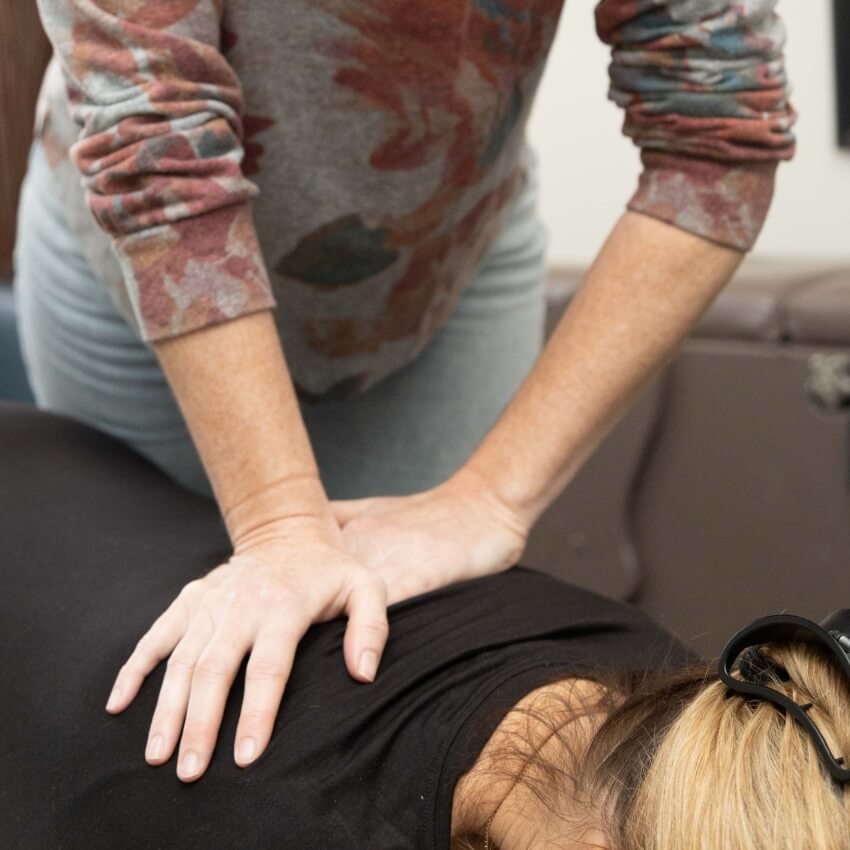 patient having back adjusted