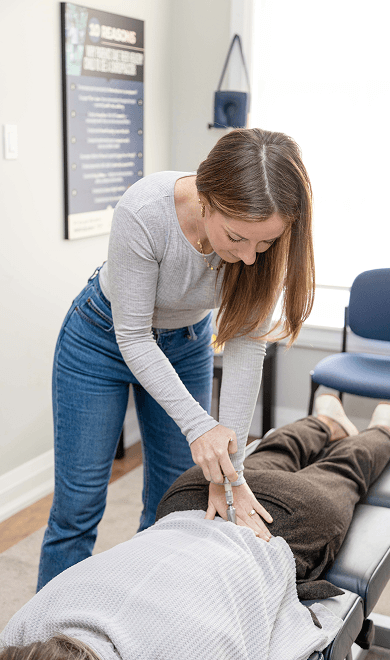 Doctor adjusting patient