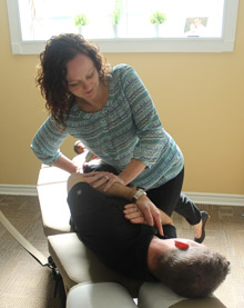 Dr. Cordick giving a chiropractic adjustment. 