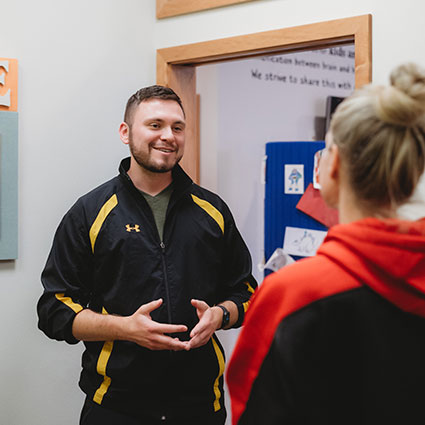 Dr. Greg greeting patient