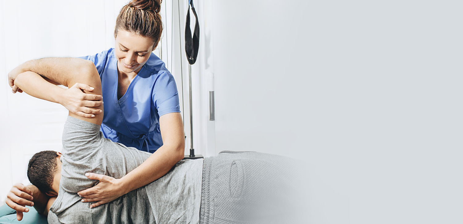 Doctor adjusting patient back